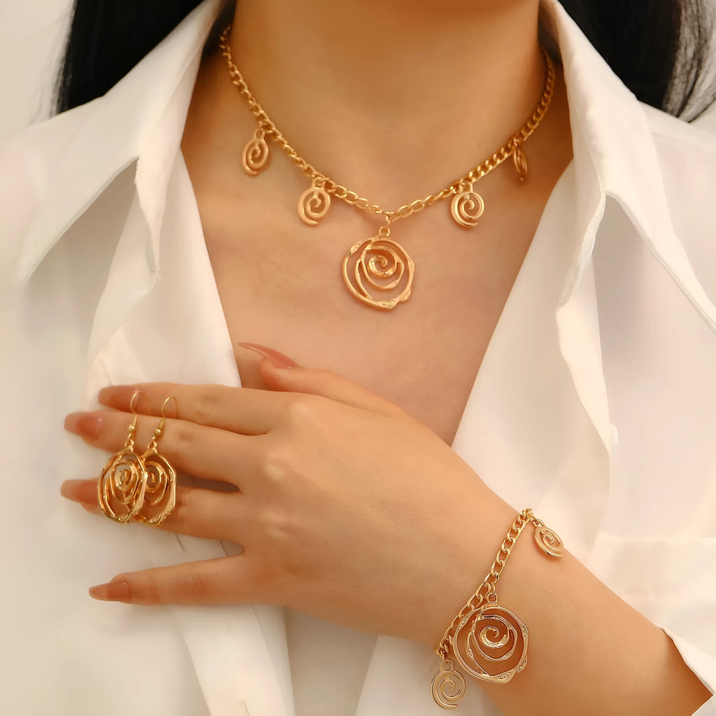 Spiral donut jewellery set showing necklace, bracelet and ear hooks with geometric circle design