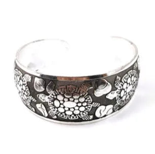 Open design Miao ethnic bracelet in silver alloy with carved turtle or elephant motif.