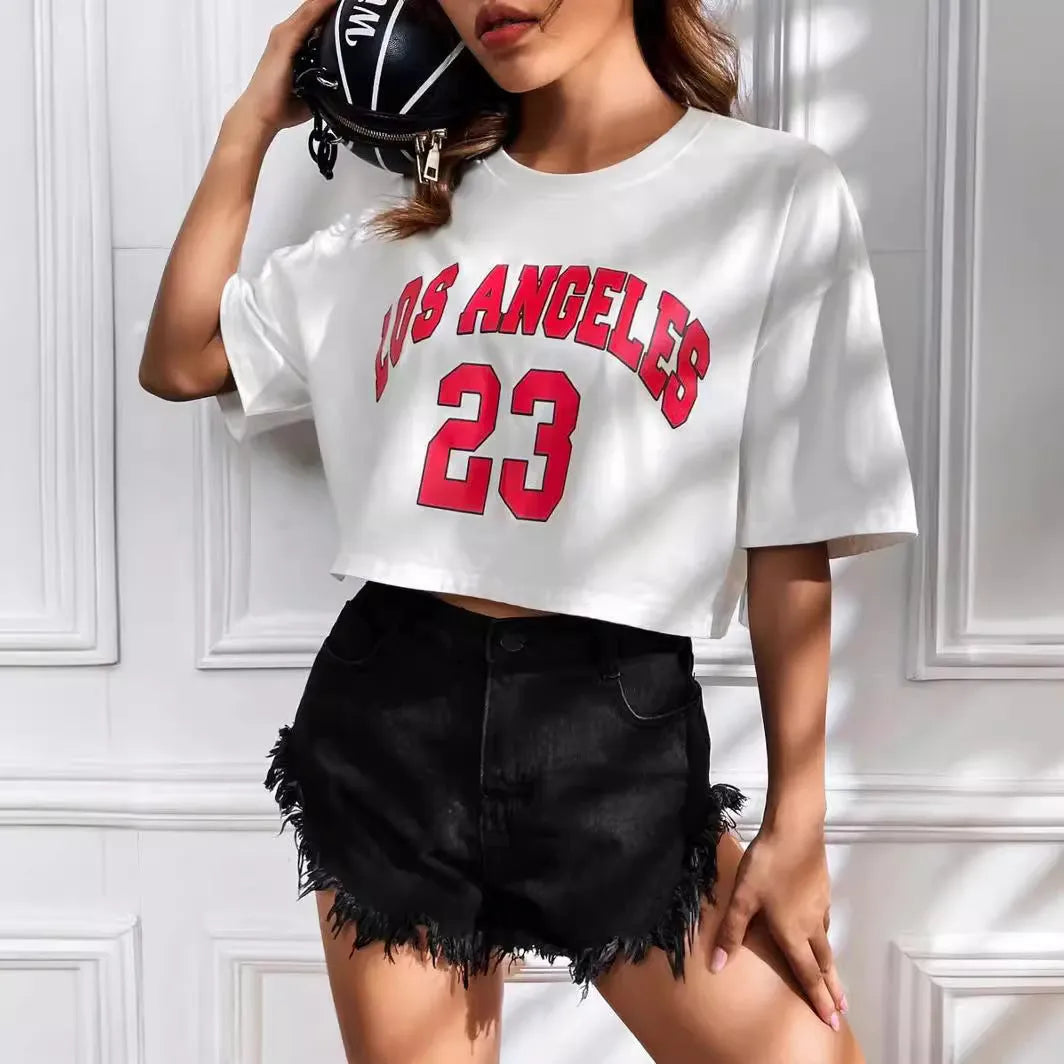 Black loose-fit cotton crop top t-shirt with printed white English letters, short sleeves, and an exposed navel.