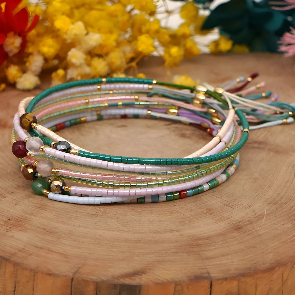 Women's handmade geometric beaded bracelet in bohemian style with glass and coloured glaze materials