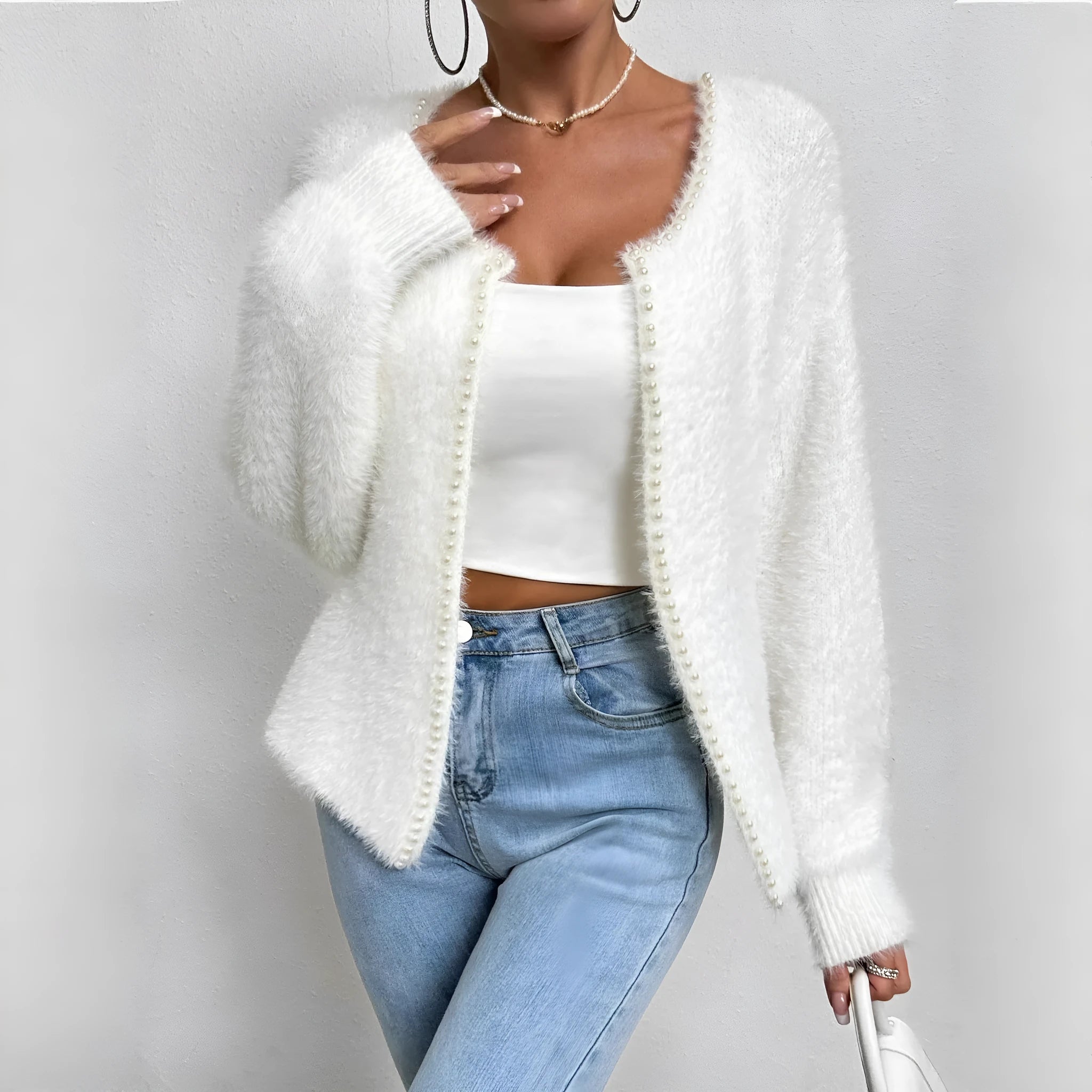 White women's V-neck cardigan sweater with polyester knit fabric and medium thickness