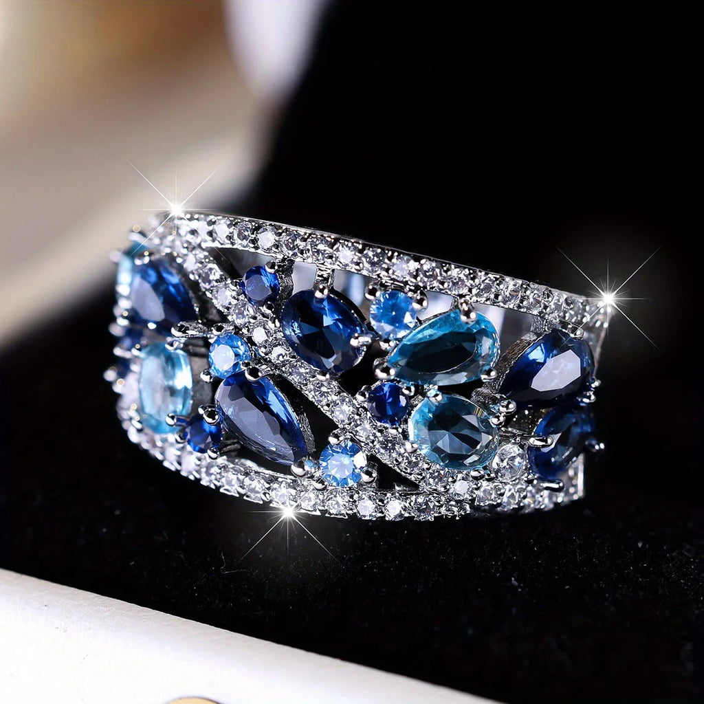 Women's hollow round copper fashion ring shown in gold and platinum with white diamond or blue sapphire accents.
