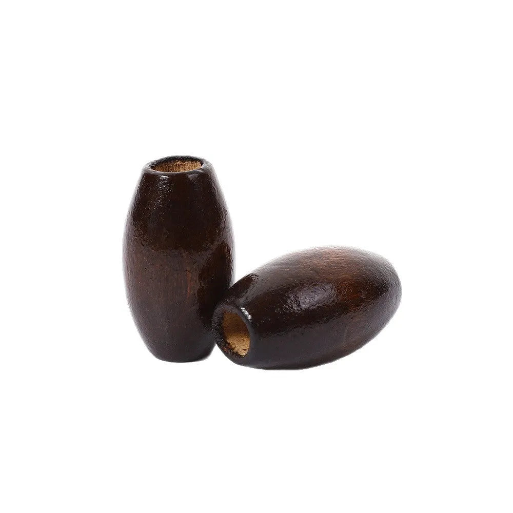 Oval wooden bead with M-shaped raised profile in dark coffee colour, 25mm size with visible centre hole
