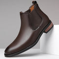 Men's black Chelsea boots with round pointed toe and visible stitching detail