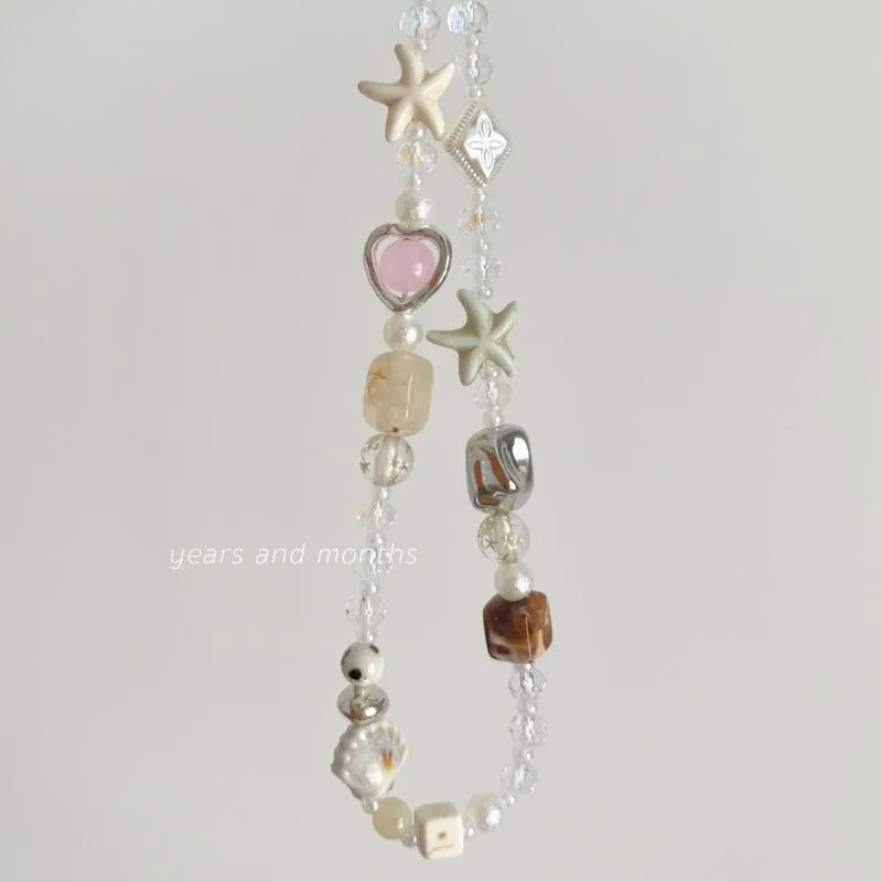 Bohemian sweetheart design mobile phone charm with beaded elements in island sweetheart colour