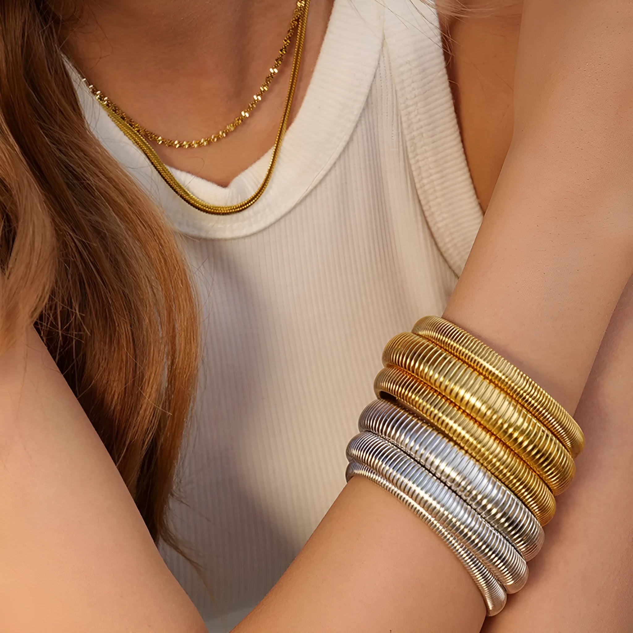 Women's elastic titanium steel bracelet with vertical stripe ring design in gold finish