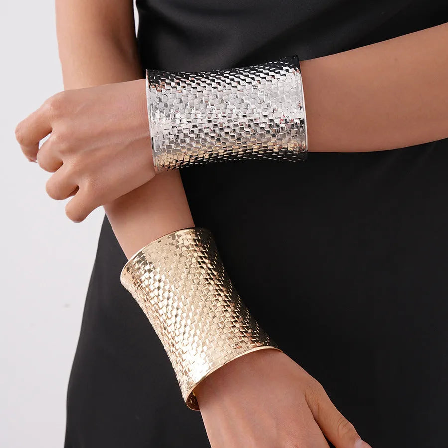 Women's vintage bracelet with large round gold charm on wrist