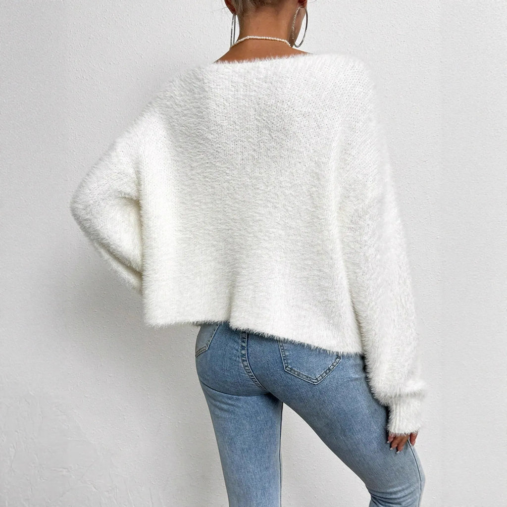 White women's V-neck cardigan sweater with polyester knit fabric and medium thickness
