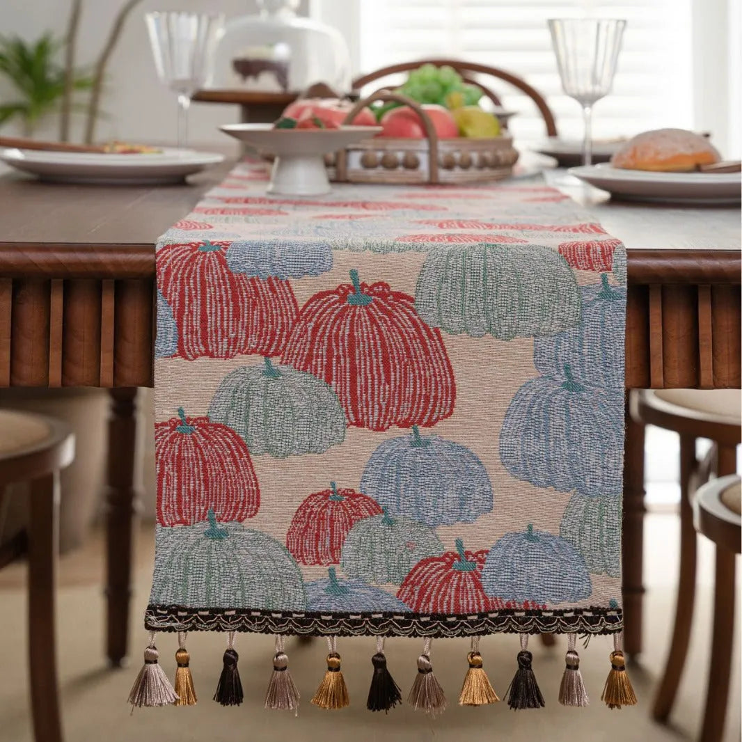 American-style beige jacquard table runner with floral pattern and long tassels on a dining table.