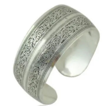 Open design Miao ethnic bracelet in silver alloy with carved turtle or elephant motif.