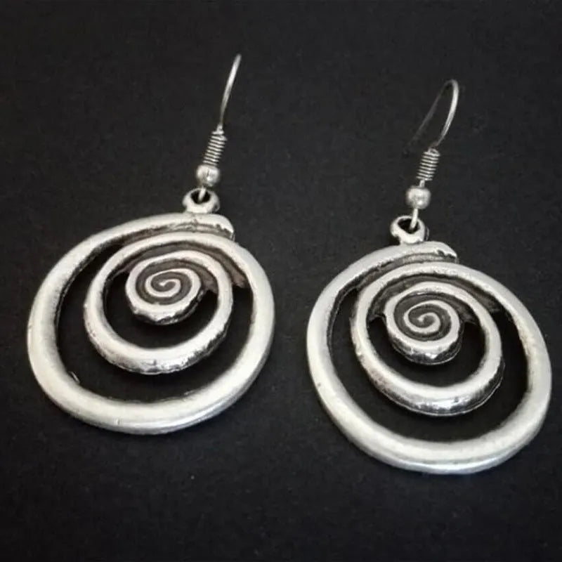 Geometric spiral distressed earrings in silver alloy with retro design measuring 2.6 by 5 cm