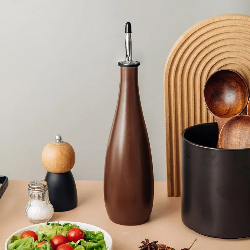 Ceramic oil pot with 650ml funnel and brush for kitchen oil storage in black, coffee, or white