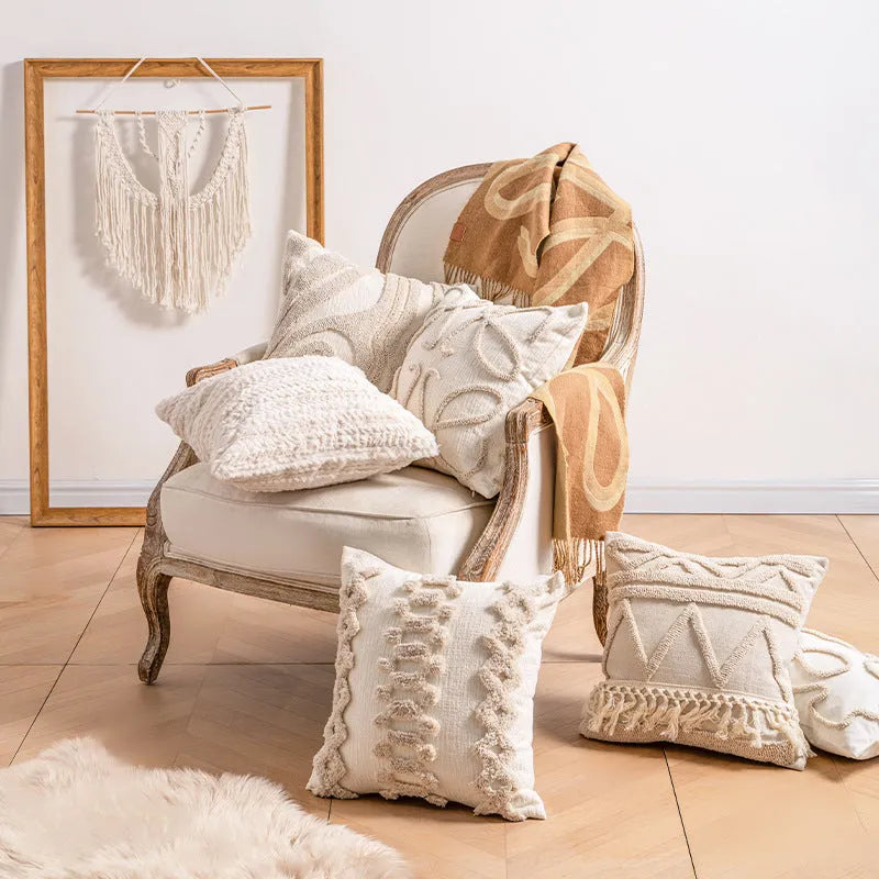 Knitted sofa pillow cover with tassel detailing in spiral dot pattern