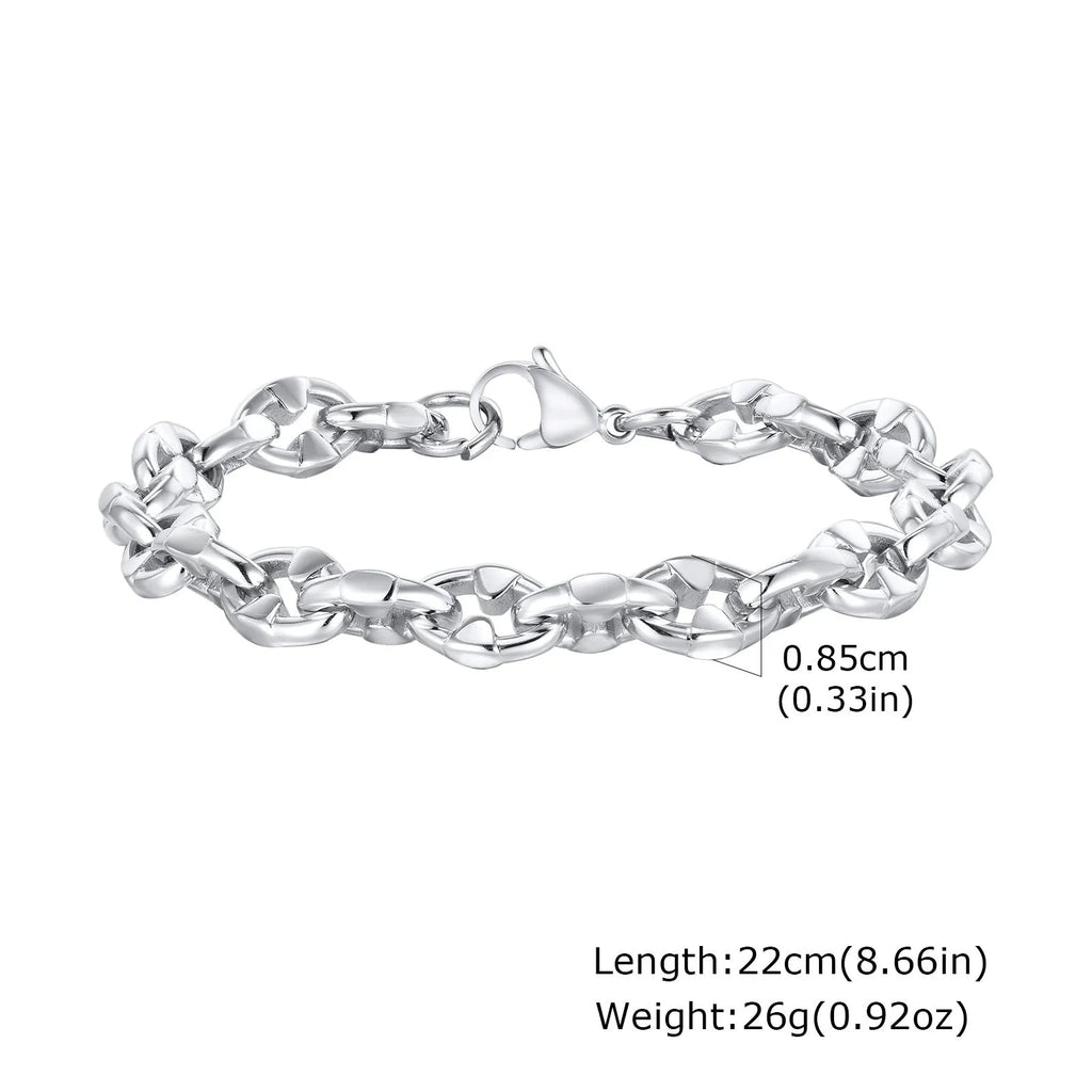 Close-up of a men's thick stainless steel geometric chain link bracelet on a wrist.