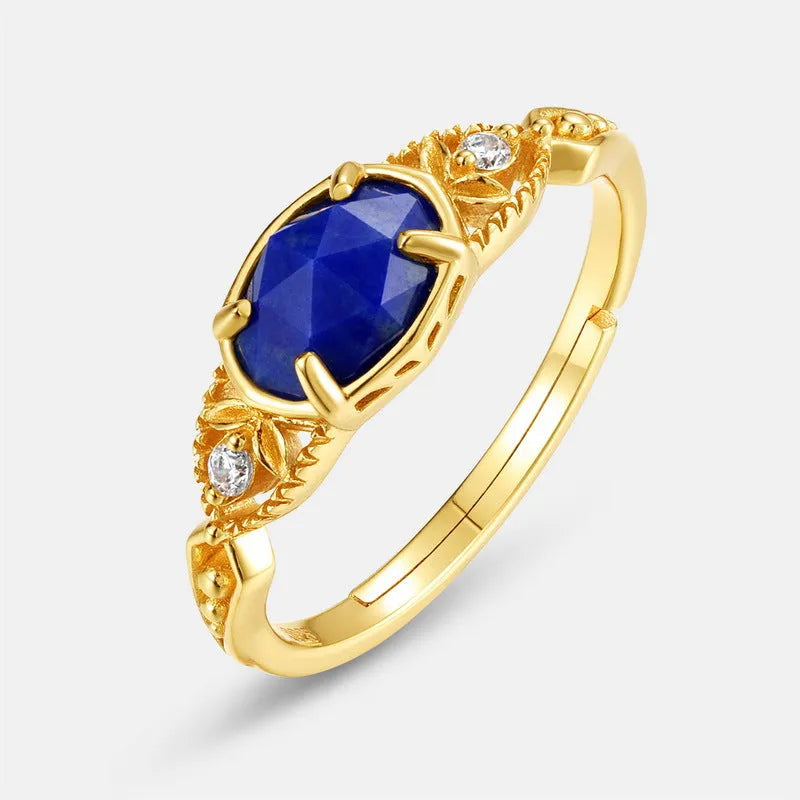 Geometric oval silver-tone alloy ring with a deep blue lapis lazuli centre stone.