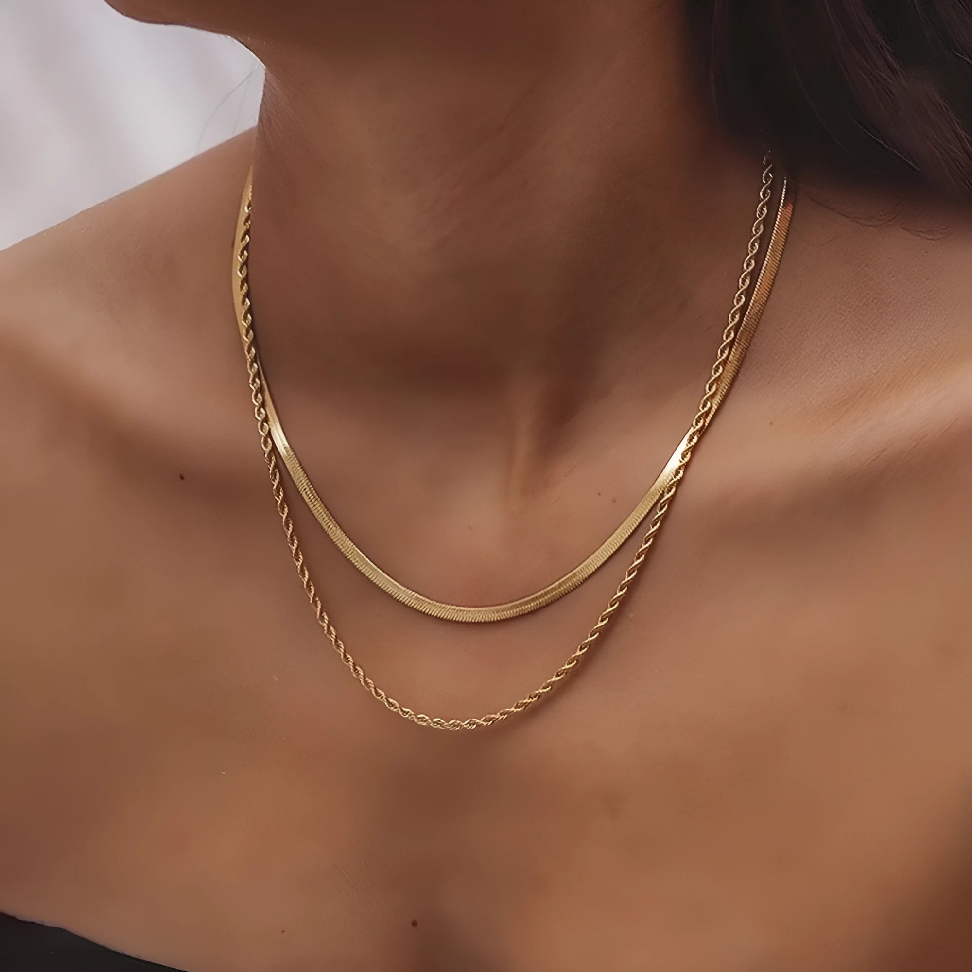 Women's adjustable double-layer twist necklace in stainless steel with a geometric titanium steel pendant.