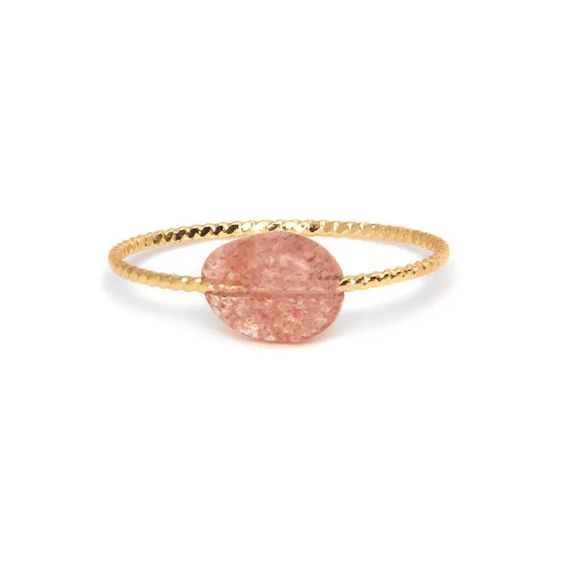 Geometric shaped agate ring for women in a solid colour on a neutral background.