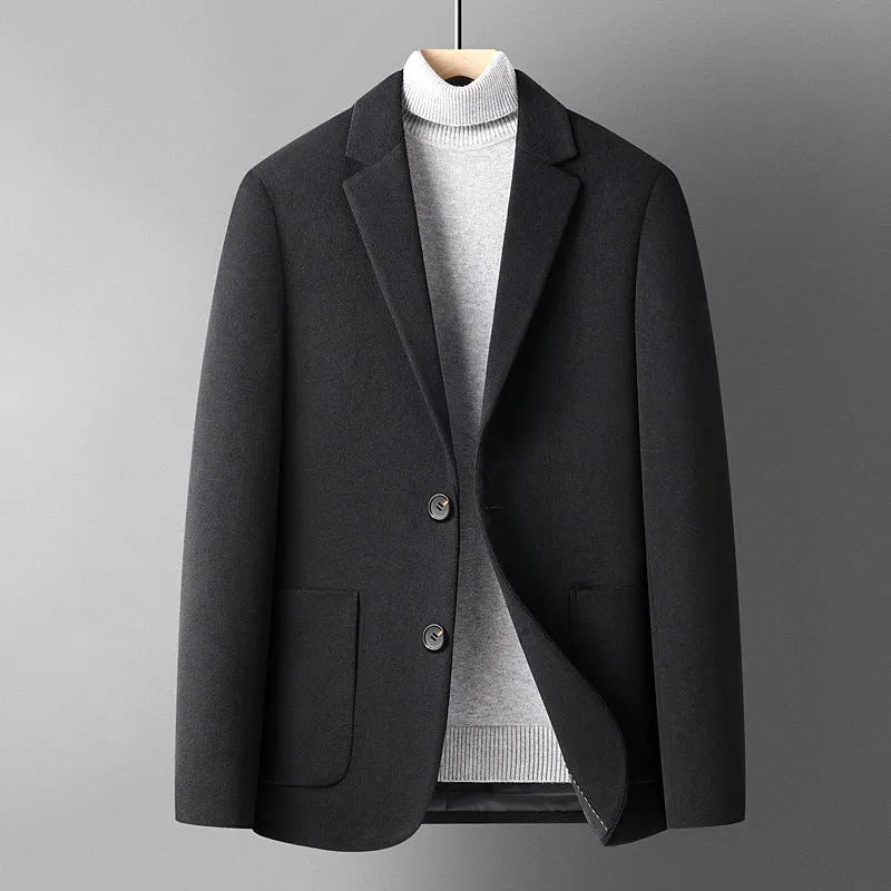 Men's slim fit wool suit jacket in grey, shown on a model, featuring a notched lapel and button front.