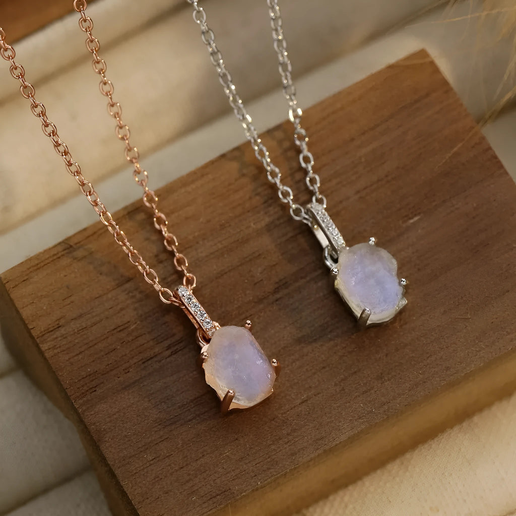 S925 sterling silver moonstone pendant necklace with geometric design on a curb chain.