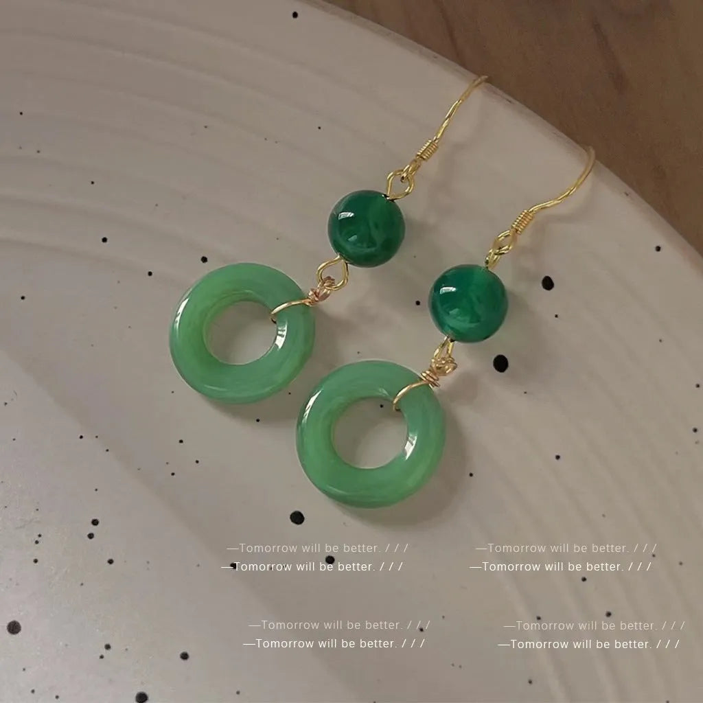 Green jade design peace buckle earrings in 14K gold colour zinc alloy