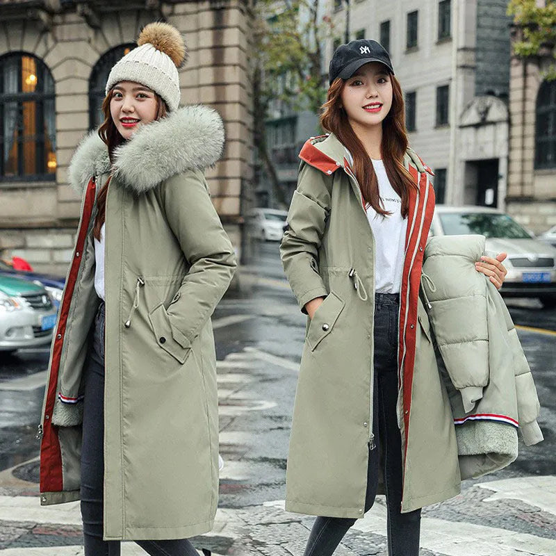 Women's long beige trench coat with cotton-padded construction and belt.