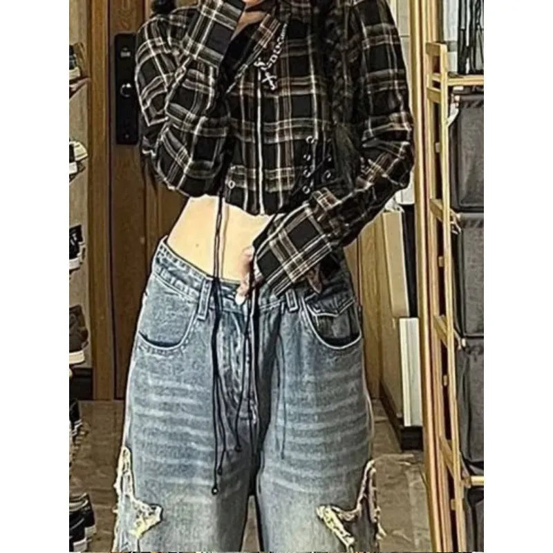 Blue high-waist straight-leg women's jeans laid flat, showing the waistband and leg cut.