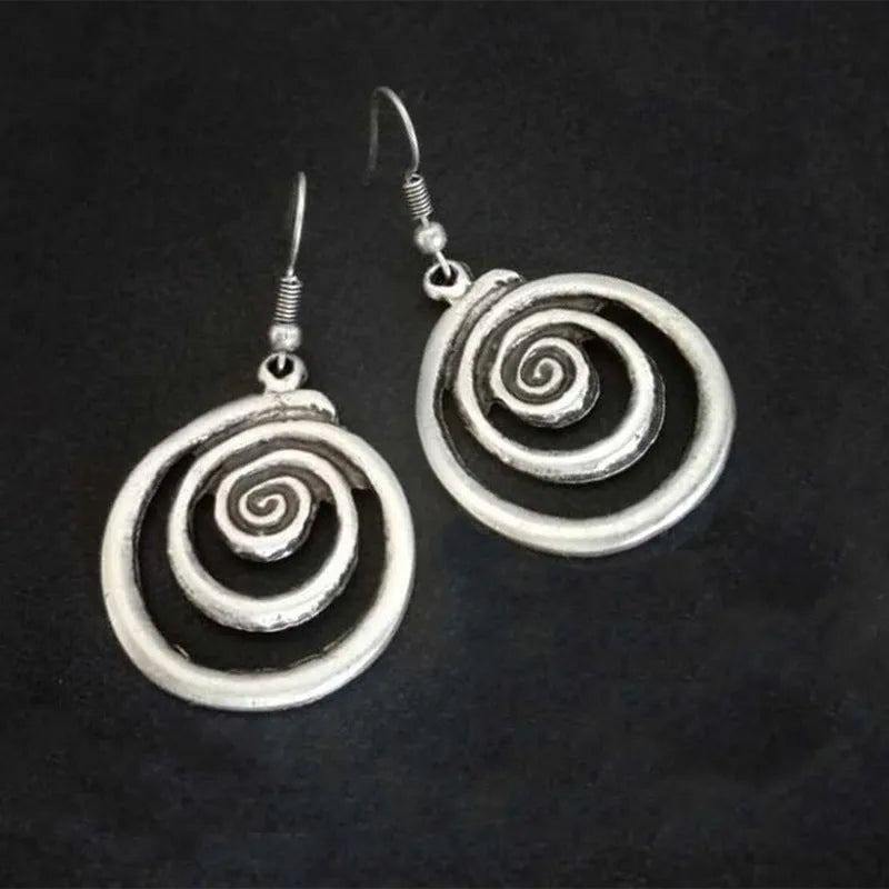 Geometric spiral distressed earrings in silver alloy with retro design measuring 2.6 by 5 cm