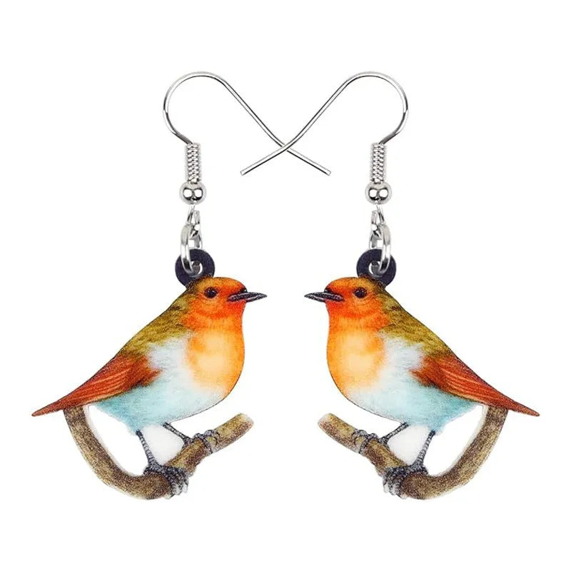 Blue Titmouse bird pendant drop earrings made from acrylic with geometric and snake design details.