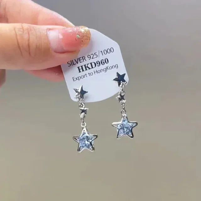 Geometric-shaped women's earrings with heart and star rhinestones and long tassel drops.