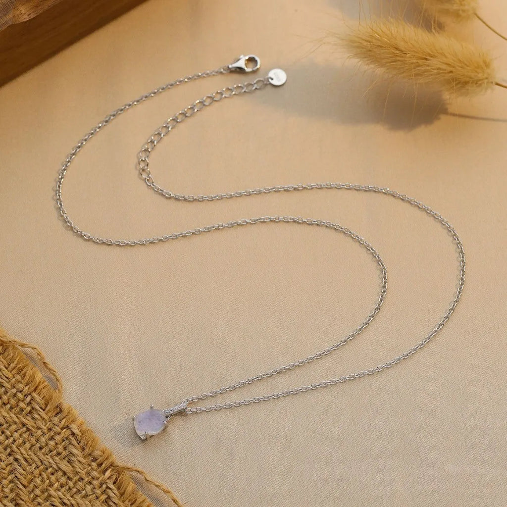 S925 sterling silver moonstone pendant necklace with geometric design on a curb chain.