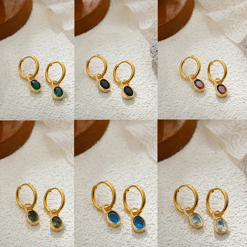 Close-up of women's retro oval zircon earrings in copper, showing the elliptical gemstone setting.