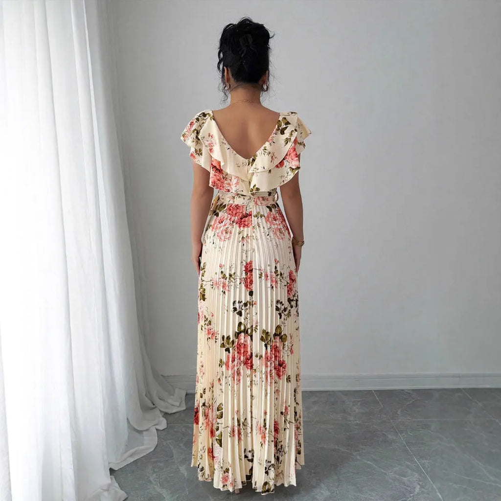 Apricot-coloured women's floral print dress with a V-neck, ruffled short sleeves, and an oversized pleated skirt.