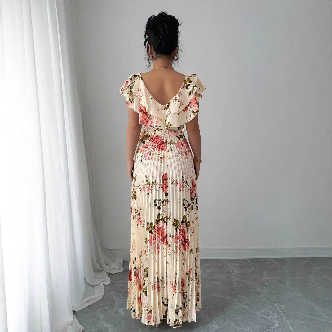 Apricot-coloured women's floral print dress with a V-neck, ruffled short sleeves, and an oversized pleated skirt.