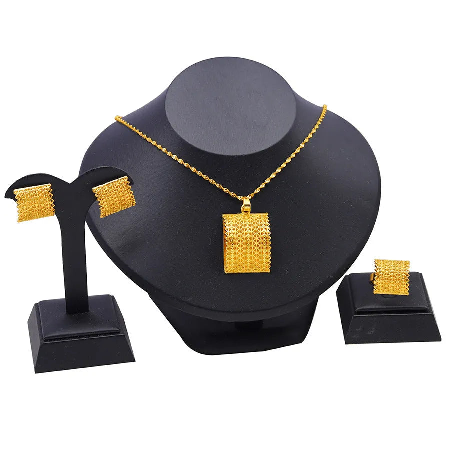Golden copper bridal jewellery set showing necklace, earrings and ring for wedding