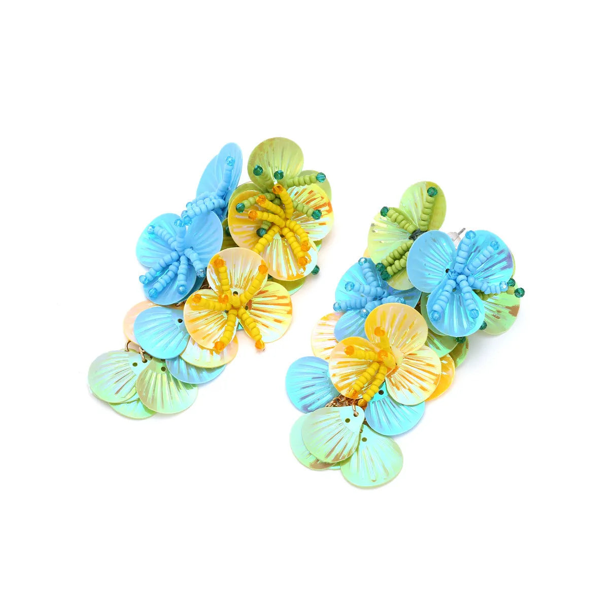 Handmade colourful flower and leaf earrings with string beads in rose and purple on a white background.