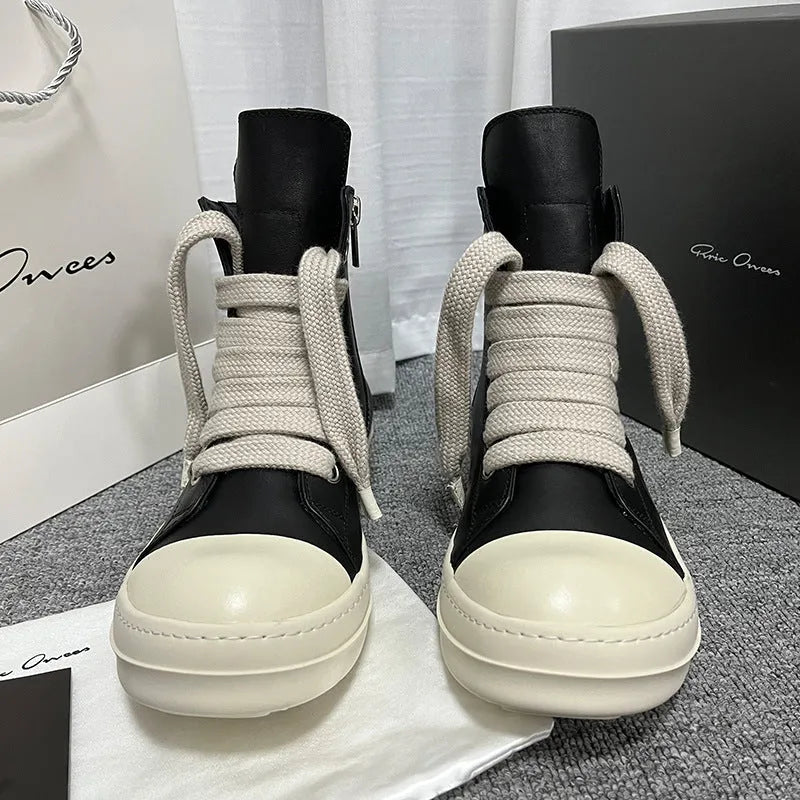 Black high-top leather casual sneakers with a side zipper and a round toe on a rubber sole.