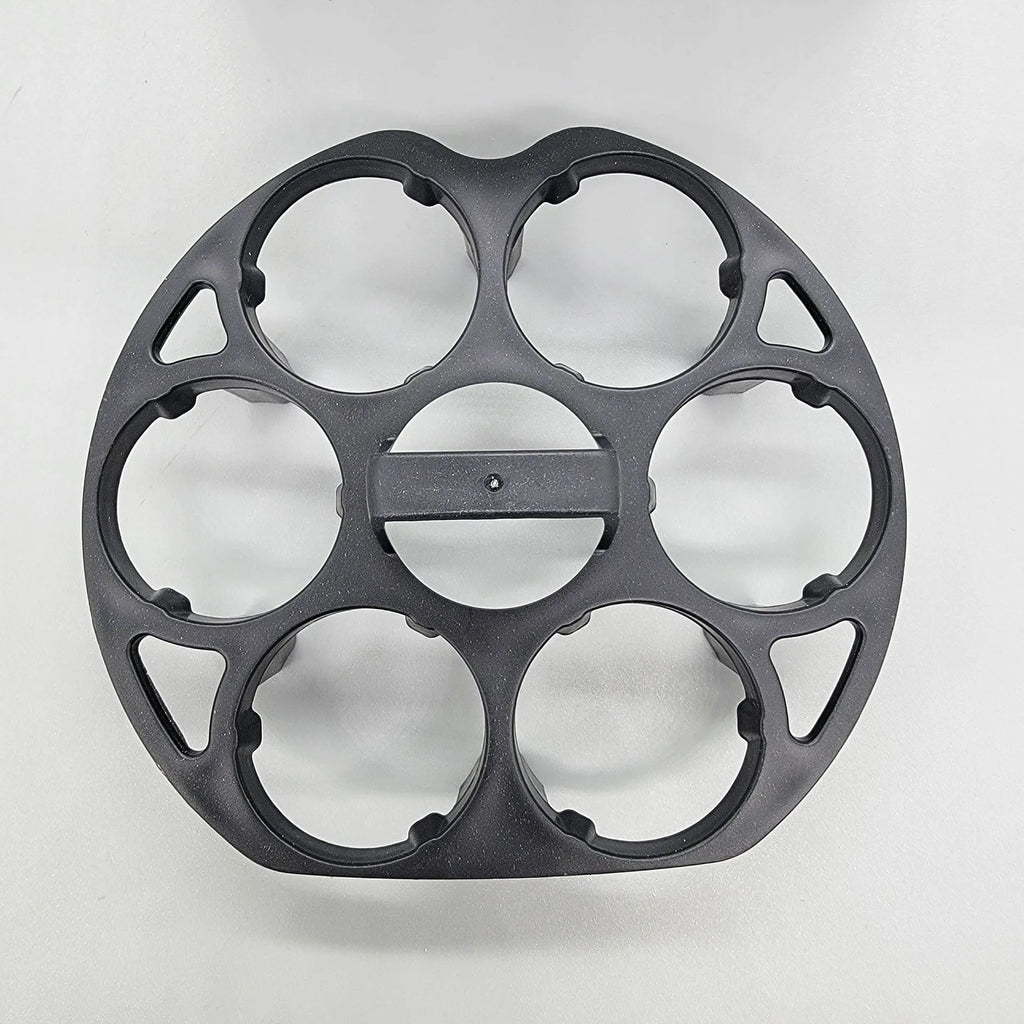Black modern plastic egg holder rack on a kitchen surface.
