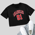 Black loose-fit cotton crop top t-shirt with printed white English letters, short sleeves, and an exposed navel.