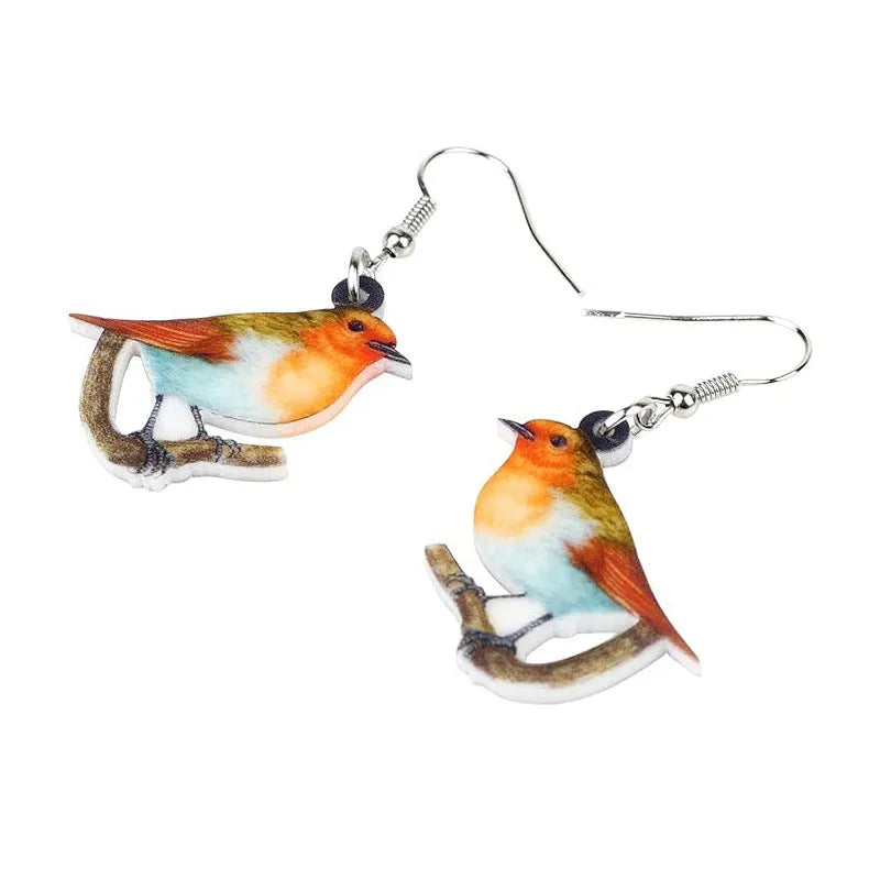 Blue Titmouse bird pendant drop earrings made from acrylic with geometric and snake design details.