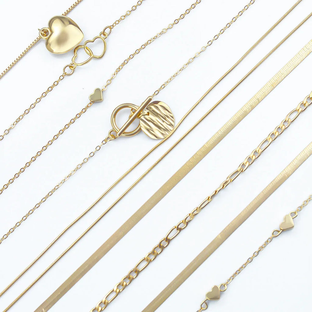 10-piece gold women's necklace set with adjustable snake bone chain and alloy pendants