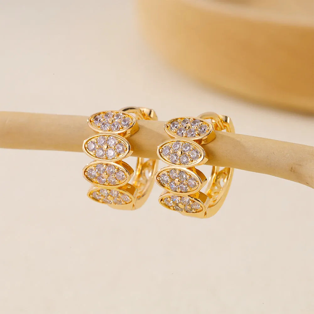 A pair of women's copper earrings with an inlaid zircon stone, designed in an ins style.
