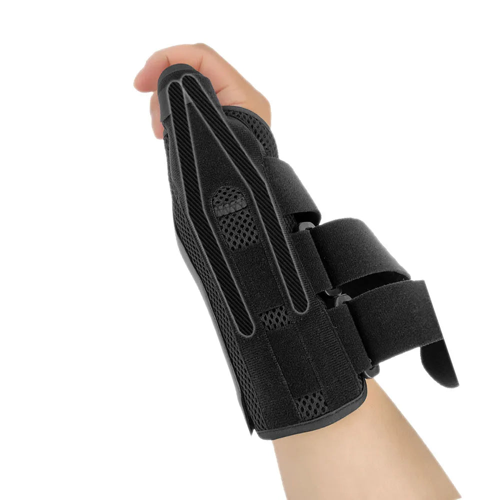 Carbon fibre sports wrist guard with thumb strap in black and grey, shown on a hand.