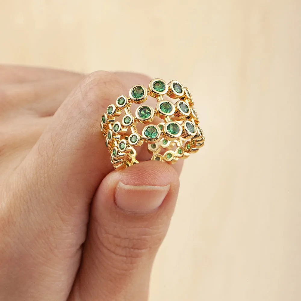 Copper wide band ring with 18K gold plating, green accents, and zircon stones