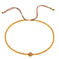 Women's handmade geometric beaded bracelet in bohemian style with glass and coloured glaze materials