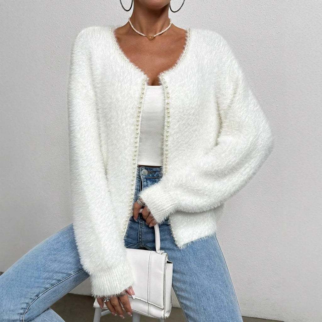 White women's V-neck cardigan sweater with polyester knit fabric and medium thickness