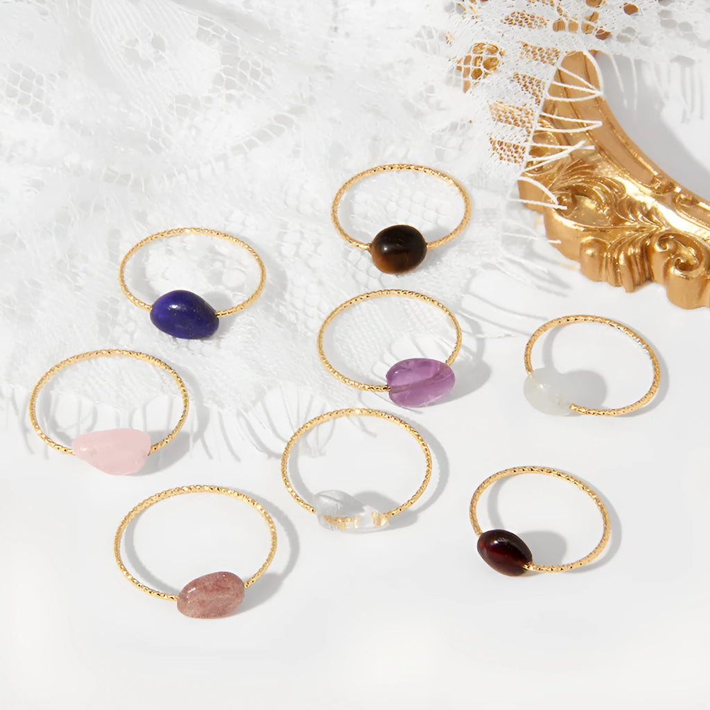 Geometric shaped agate ring for women in a solid colour on a neutral background.