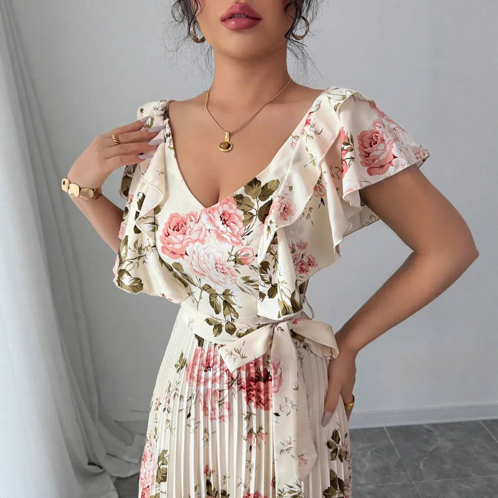 Apricot-coloured women's floral print dress with a V-neck, ruffled short sleeves, and an oversized pleated skirt.
