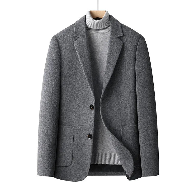 Men's slim fit wool suit jacket in grey, shown on a model, featuring a notched lapel and button front.