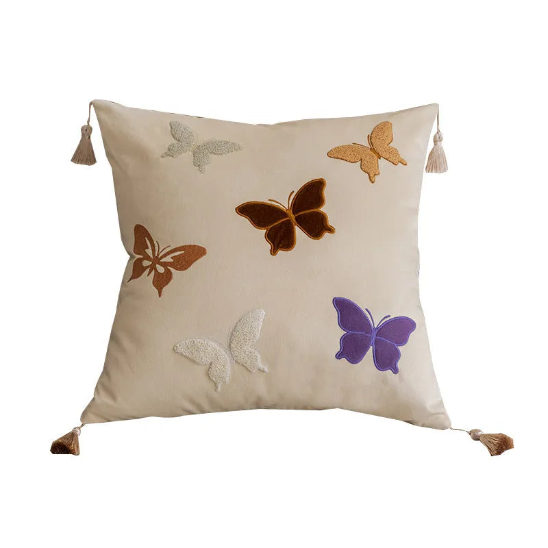 Square beige, black, and purple cushion with embroidered Chinese butterfly pattern.