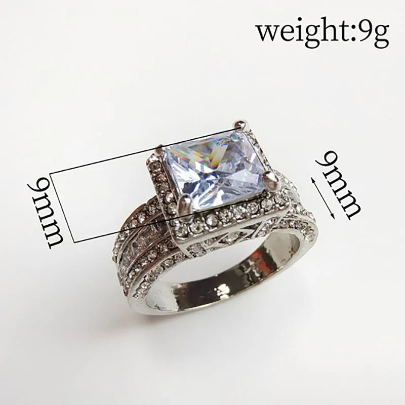Geometric style women's alloy ring in gold or white electroplated finish on a UK size chart.